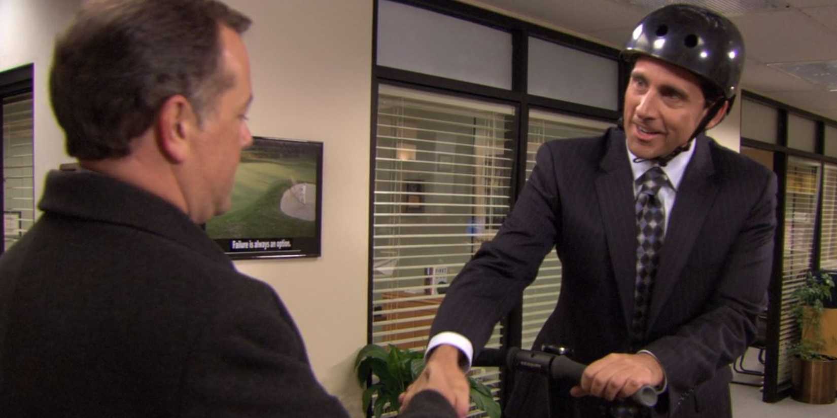 Michael (Steve Carell) greets the banker (David Constabile) in The Office