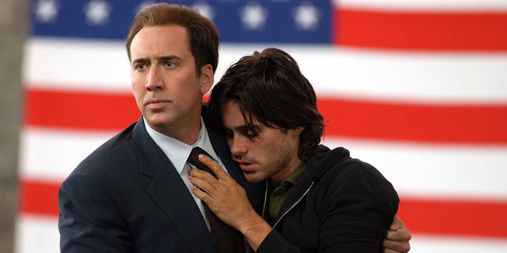 Nicolas Cage and Jared Leto against an American flag in Lord of War