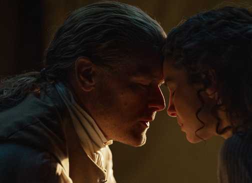 Jamie and Claire with their foreheads pressed together in Outlander season 7 episode 15