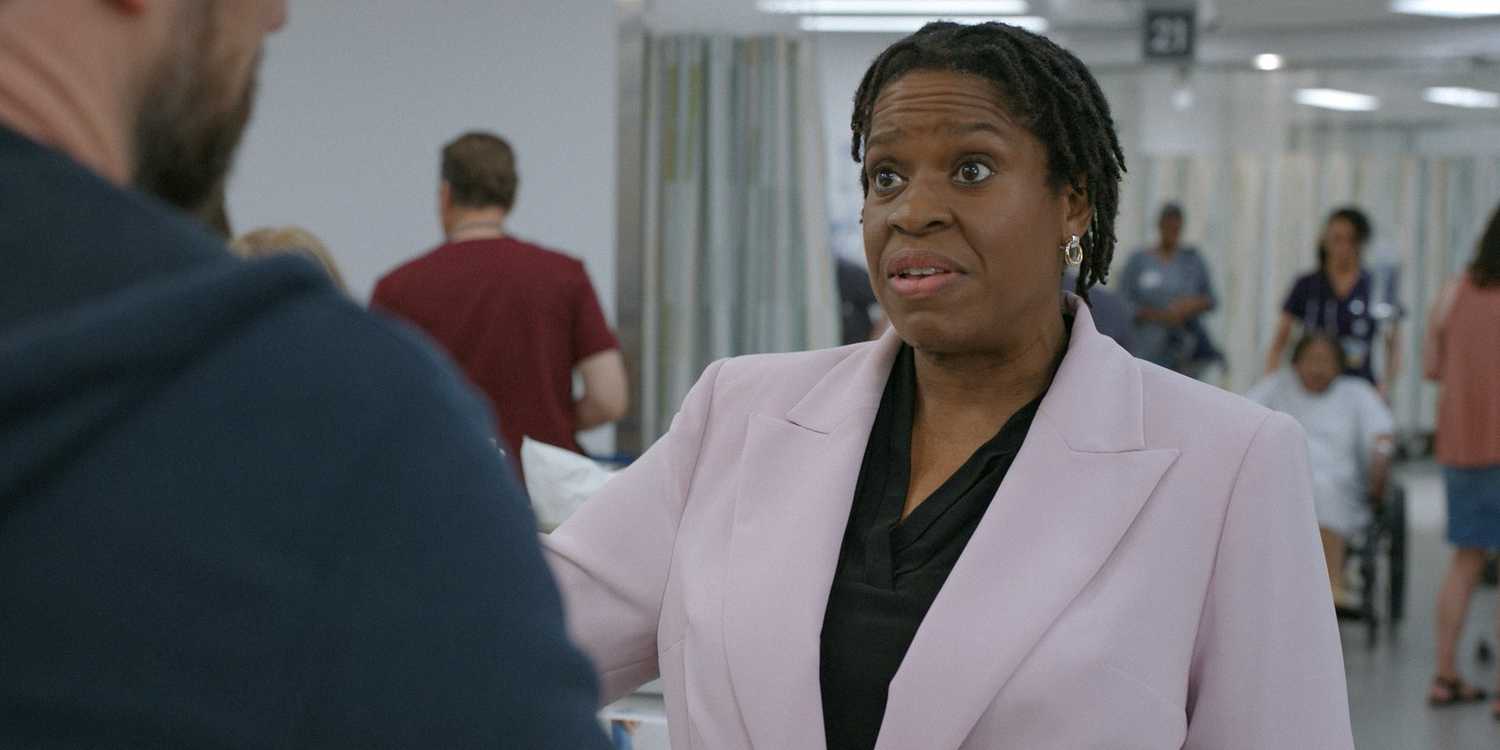Gloria (Michael Hyatt) the hospital administrator looking annoyed in The Pitt Season 1 Ep 1