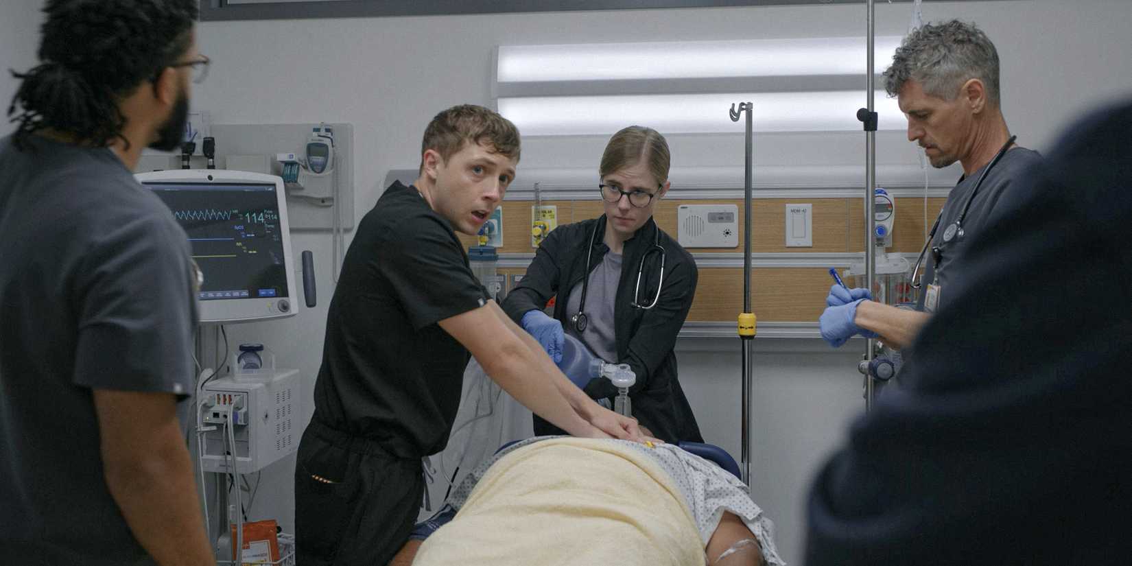 Dennis doing chest compressions on a deceased patient in The Pitt