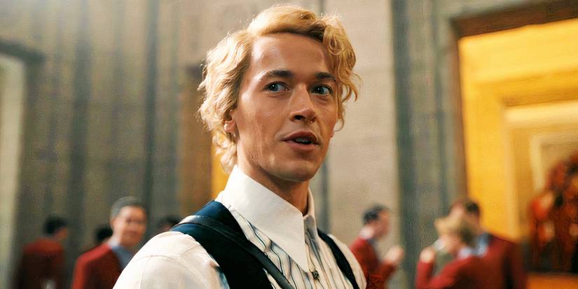 Tom Blyth smirking as Coriolanus Snow in The Hunger Games_ The Ballad of Songbirds and Snakes