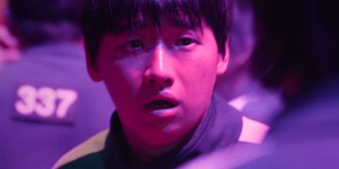David Lee looking shocked as Park Min-su in Squid Game