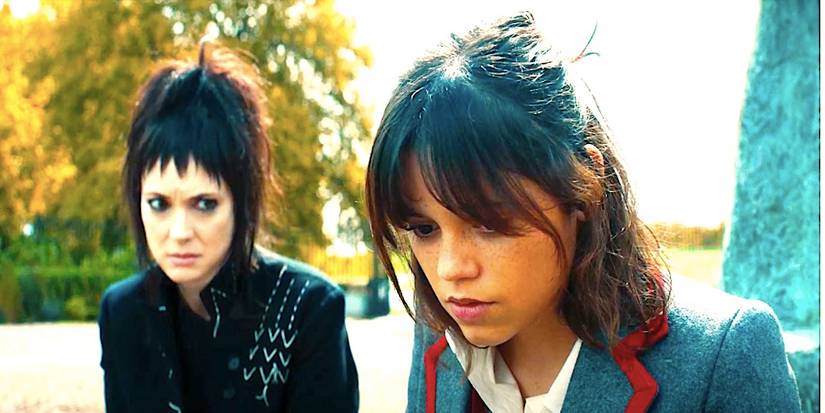 Winona Ryder's Lydia sits beside Jenna Ortega's Astrid in Beetlejuice Beetlejuice