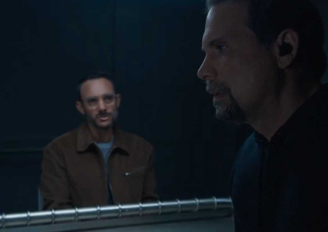 FBI Jubal standing and looking upset while Faheem sits at the interrogation table