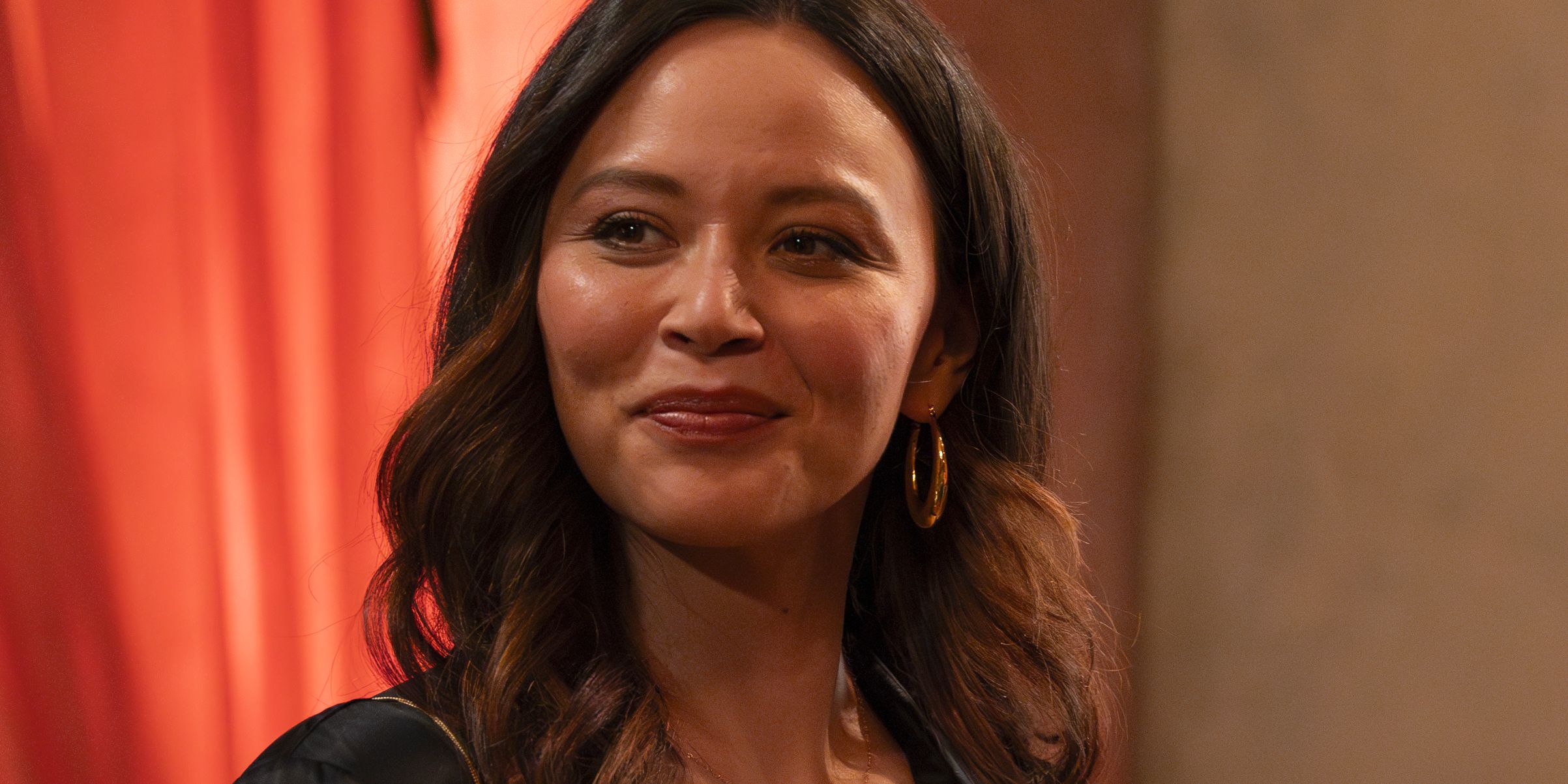 Lucy Chen smiling at the gala in The Rookie season 7, episode 6