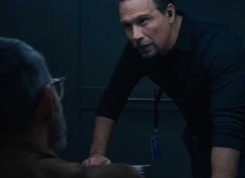 FBI Jubal leaning over the interrogation table looking Faheem in the eye