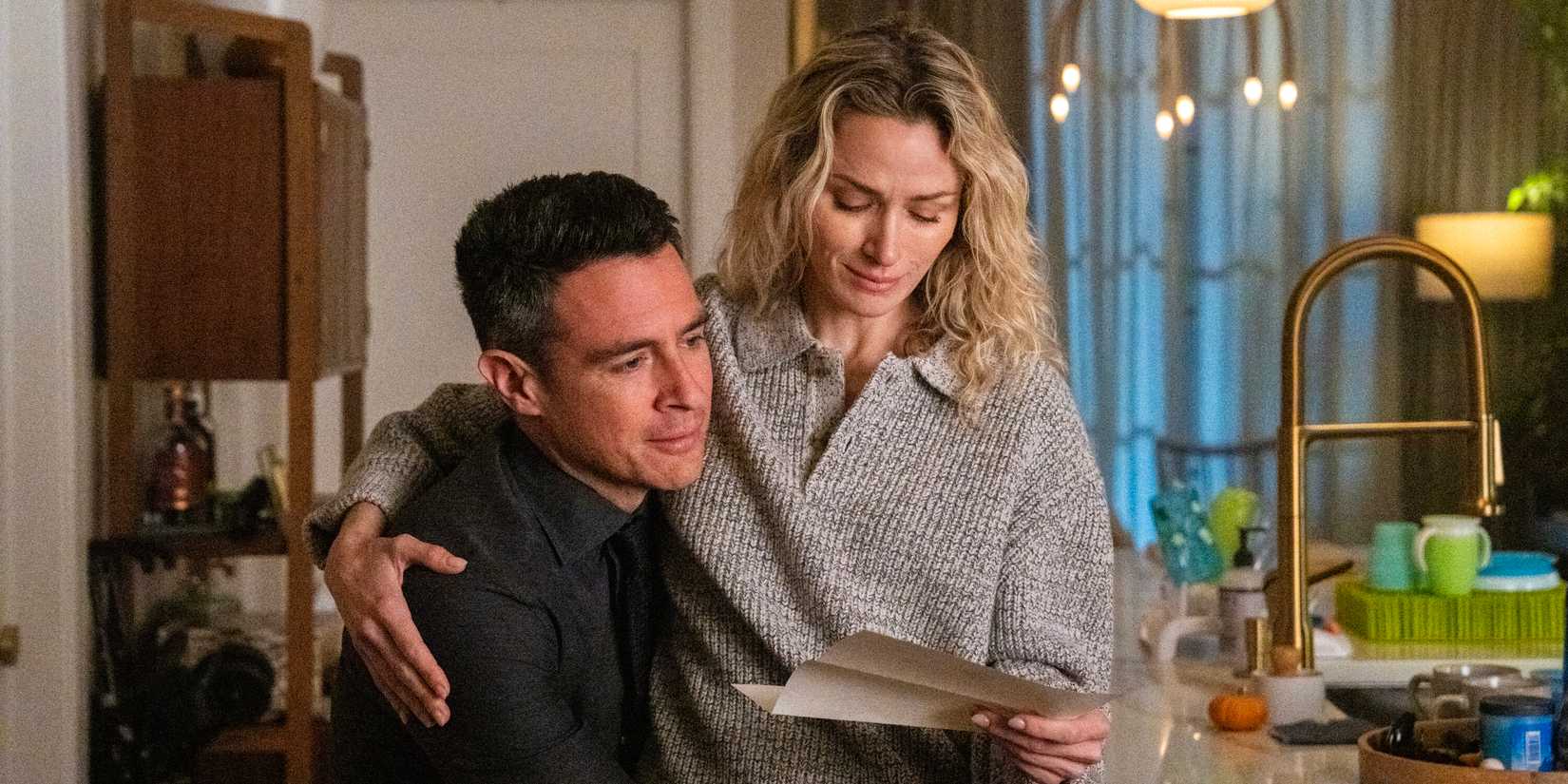 Nina Chase sitting on Stuart Scola's lap in FBI season 7, episode 9