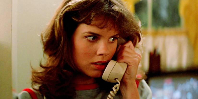 A girl looking scared on the phone in Christine 1983