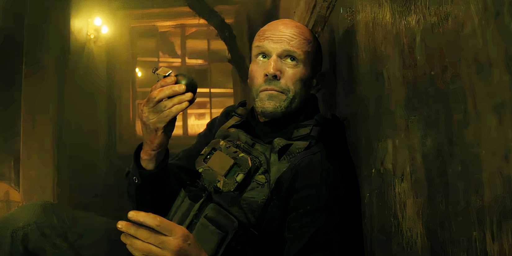 Jason Statham holding a grenade in A Working Man