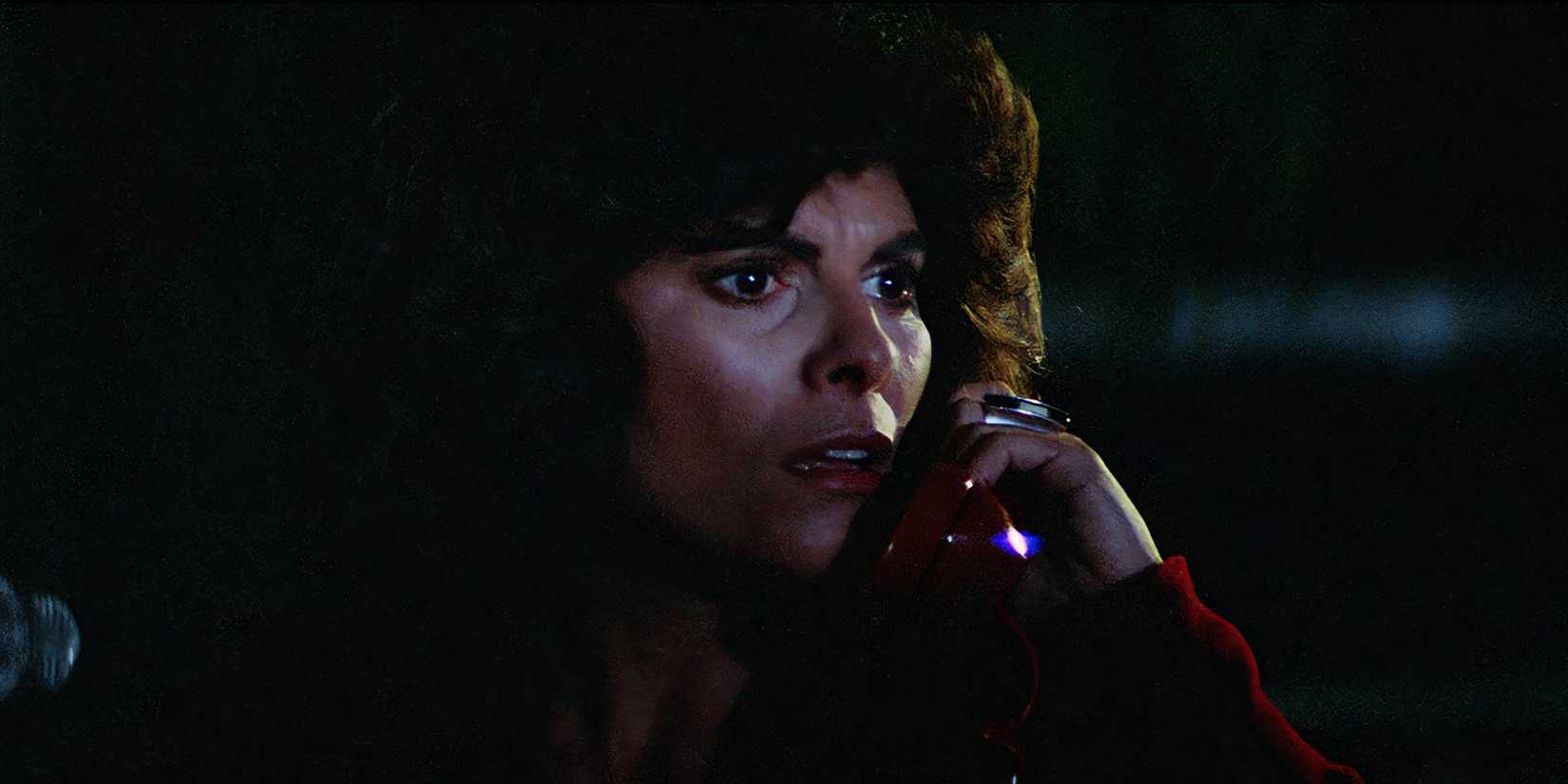 Adrienne Barbeau as Stevie looking worried while talking on the phone in The Fog