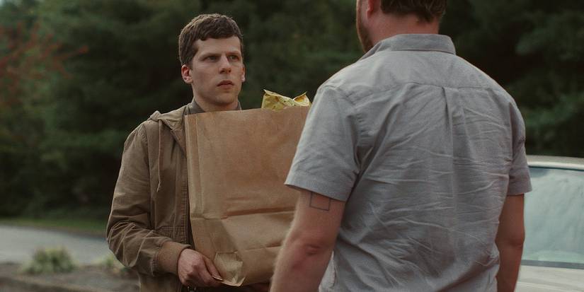 Casey carrying groceries in The Art of Self-Defense