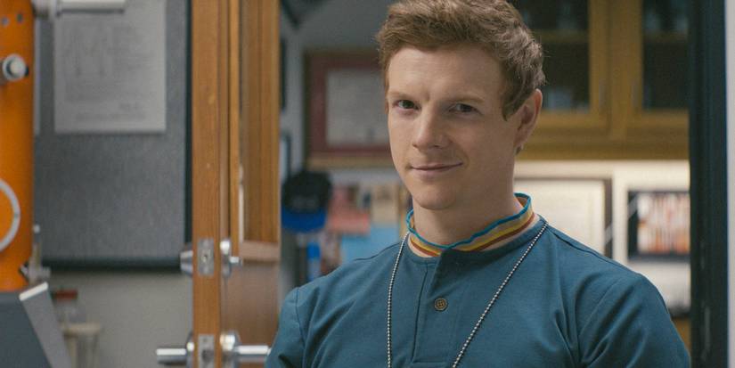 Dexter smiling while at a lab in Original Sin
