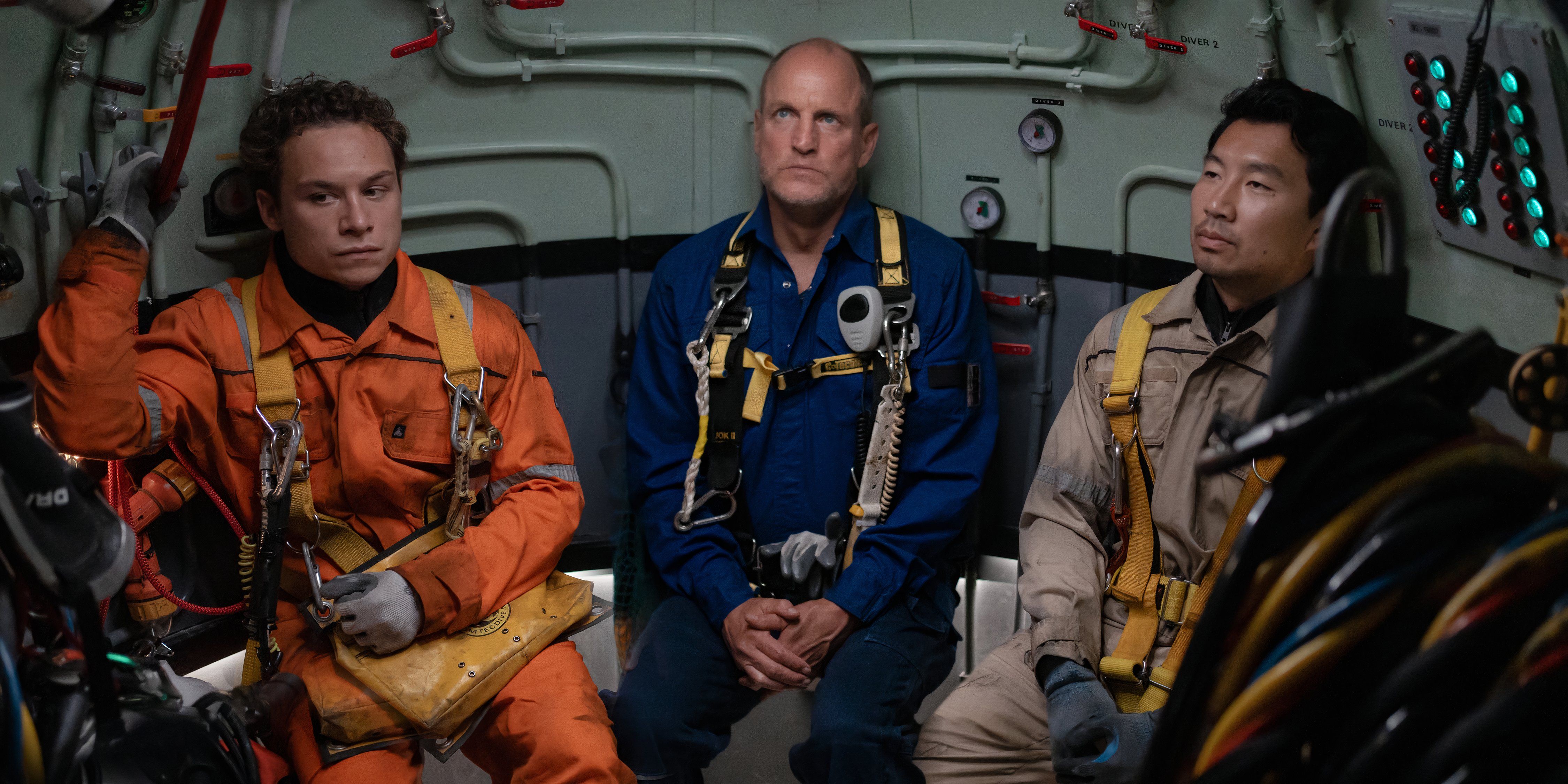 Finn Cole, Woody Harrelson, and Simu Liu sit together in their diving gear in Last Breath