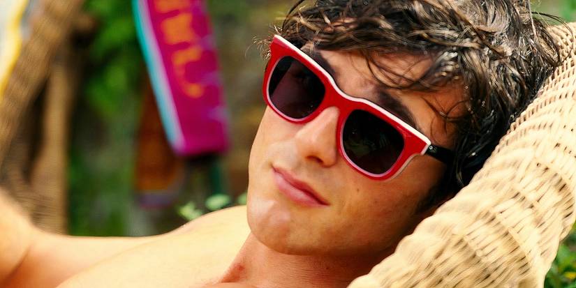 Jacob Elordi lounging while wearing sunglᴀsses in Saltburn