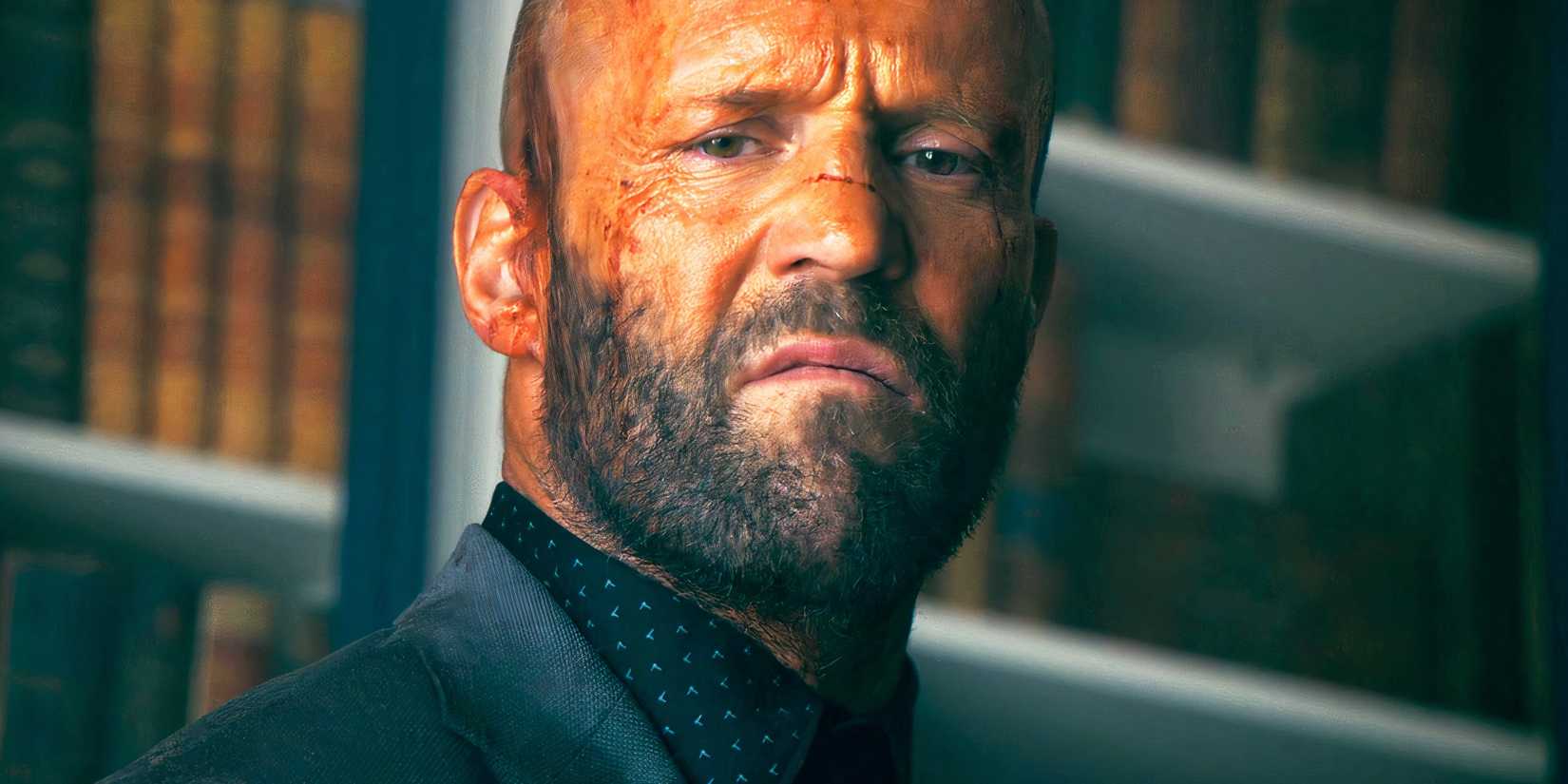 Jason Statham grimacing as Adam Clay in The Beekeeper