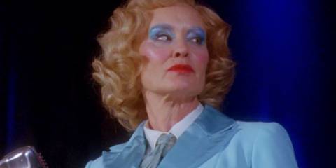 Jessica Lange as Elsa Mars looking off to the side while wearing stage makeup in American Horror Story Freak Show