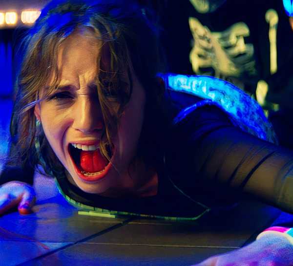 Maya Hawke screaming as she gets attacked by a masked killer in Fear Street Part One 1994