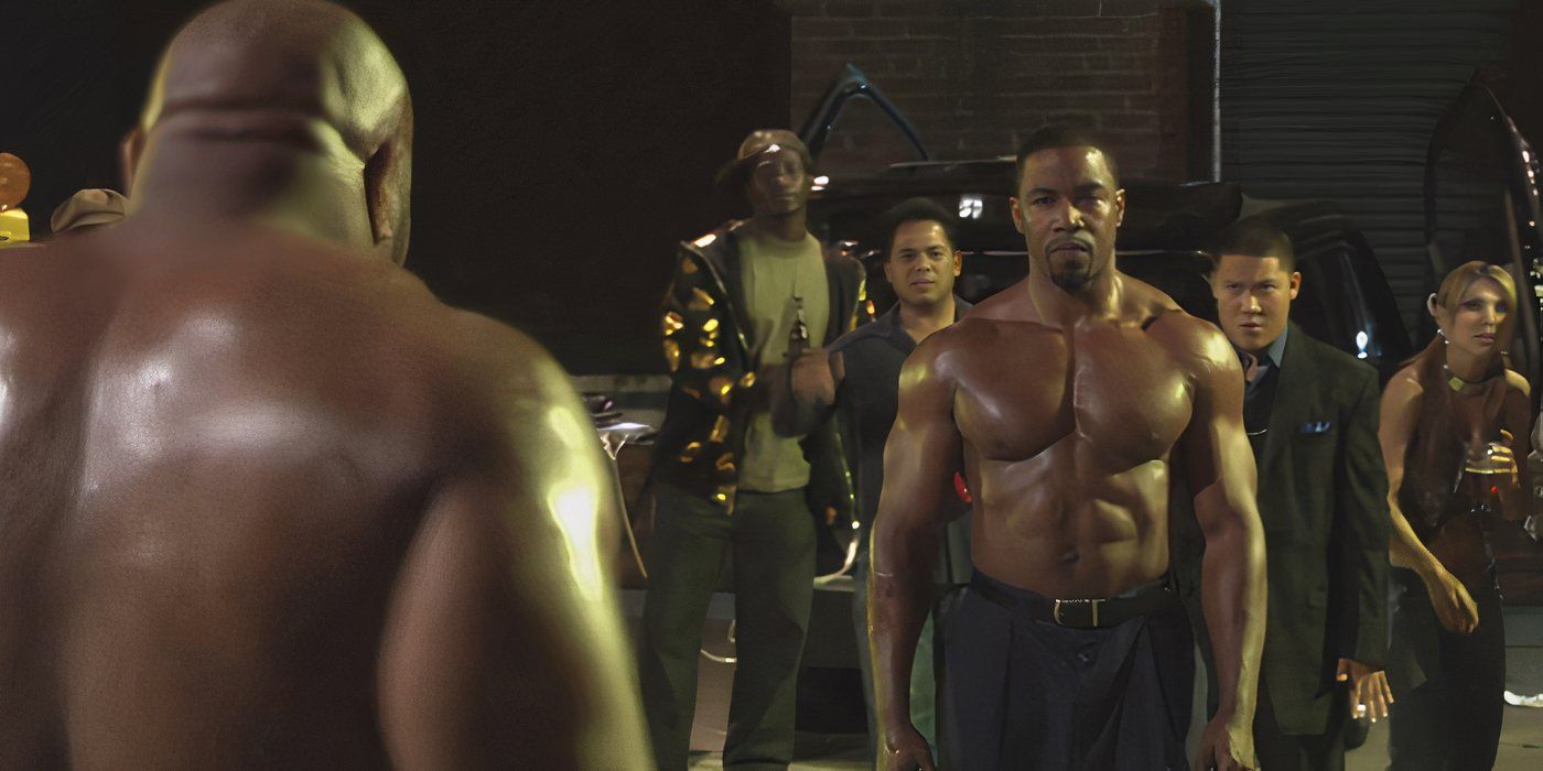 Michael Jai White stands across an opponent in Blood and Bone.