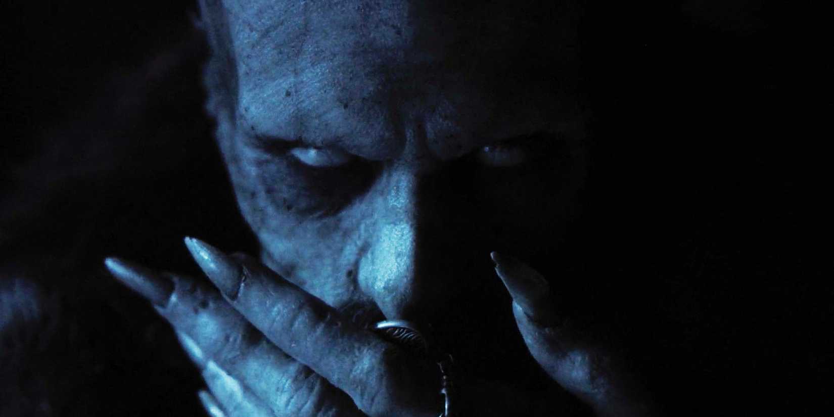 Count Orlok (Bill Skarsgård) sniffing the locket in Nosferatu 2024