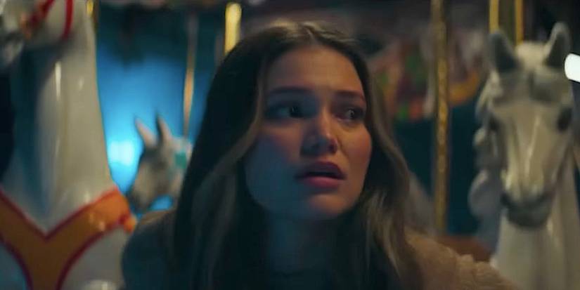Olivia Holt's Ally looking panicked on a merry go round in Heart Eyes 2025