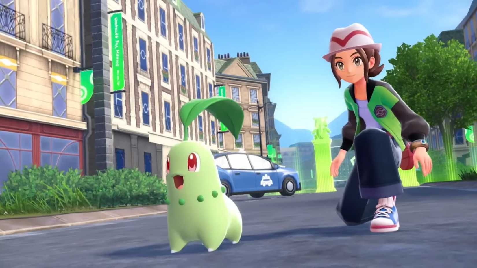 Player crouching next to chikorita in a sunny lumiose city in Pokemon Legends ZA