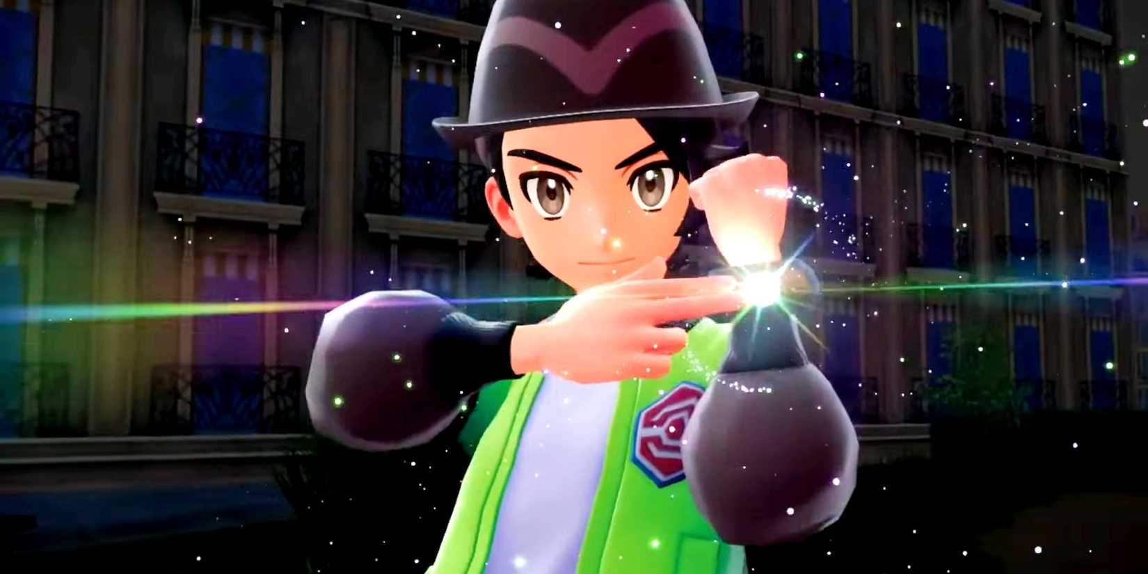 Pokemon legends za player holding up his arm and pointing to a device on his wrist that shines