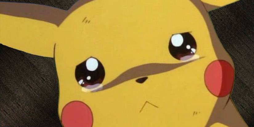 Pikachu looking sad on a dark background.