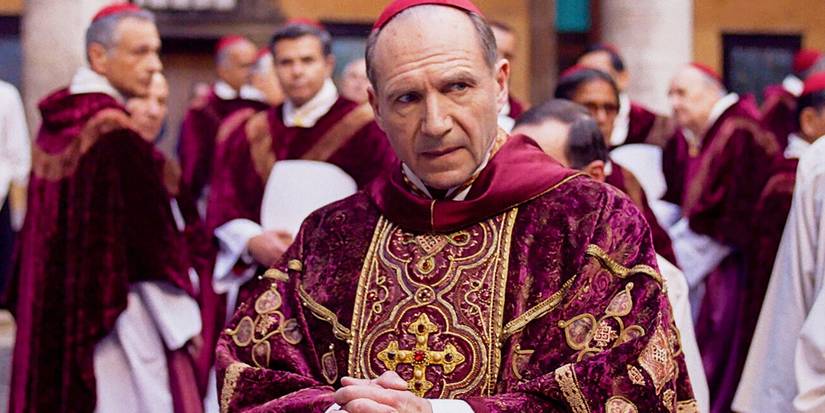 Ralph Fiennes as Cardinal Lawrence looking around in Conclave