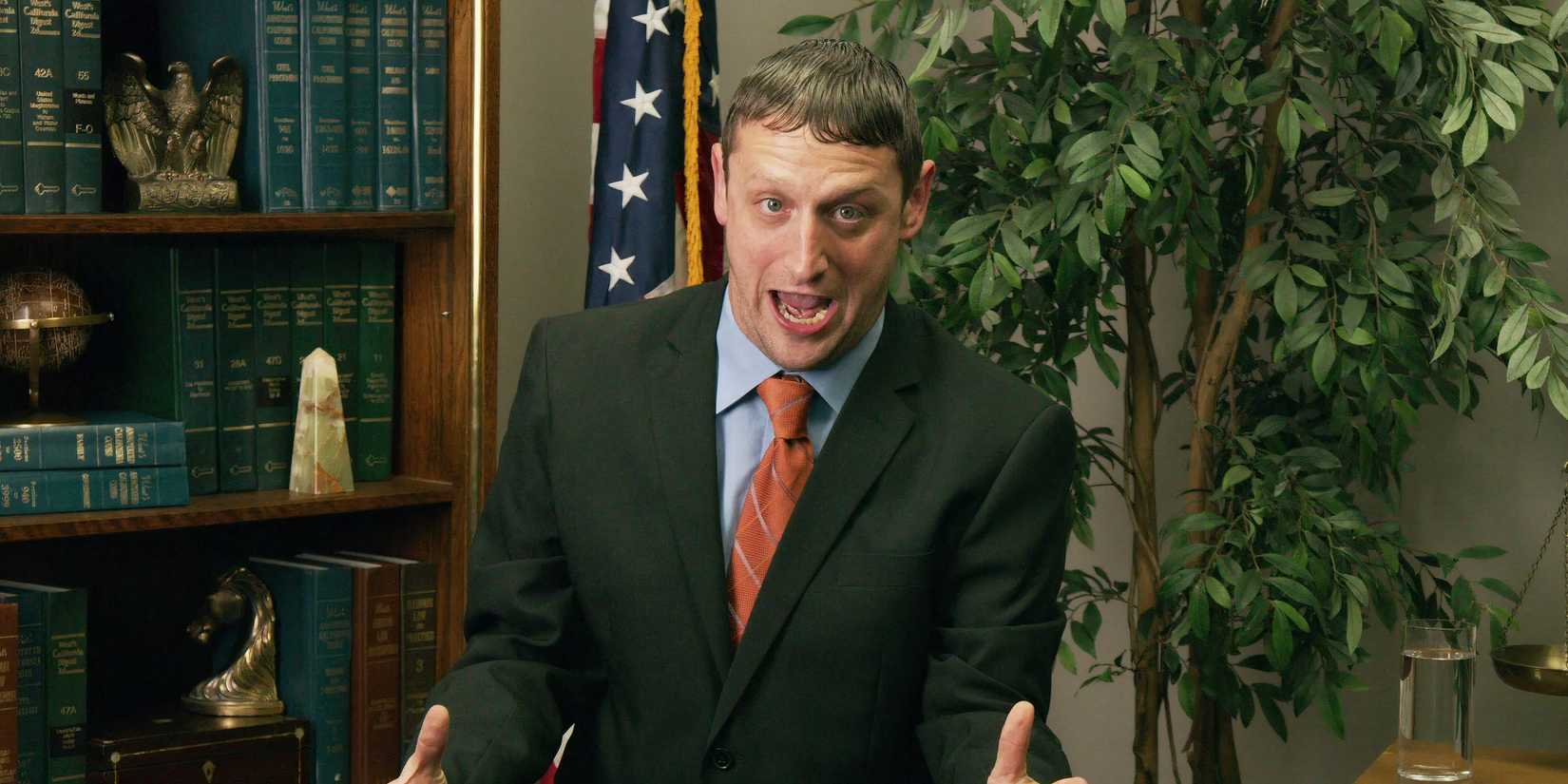 Tim Robinson as a sleazy lawyer next to a book shelf in an I Think You Should Leave sketch