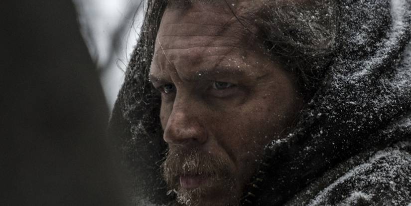 Tom Hardy with flecks of snow covering his fur clothing in The Revenant
