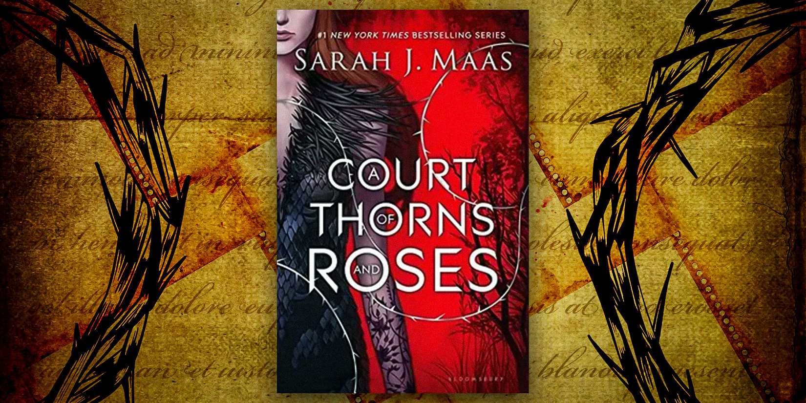 The original cover of A Court of Thorns & Roses and a brown paper background with ink on it