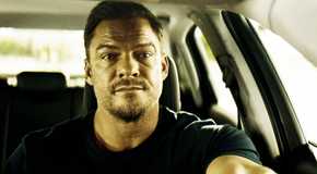 Alan Ritchson as Jack Reacher, driving, in season 3
