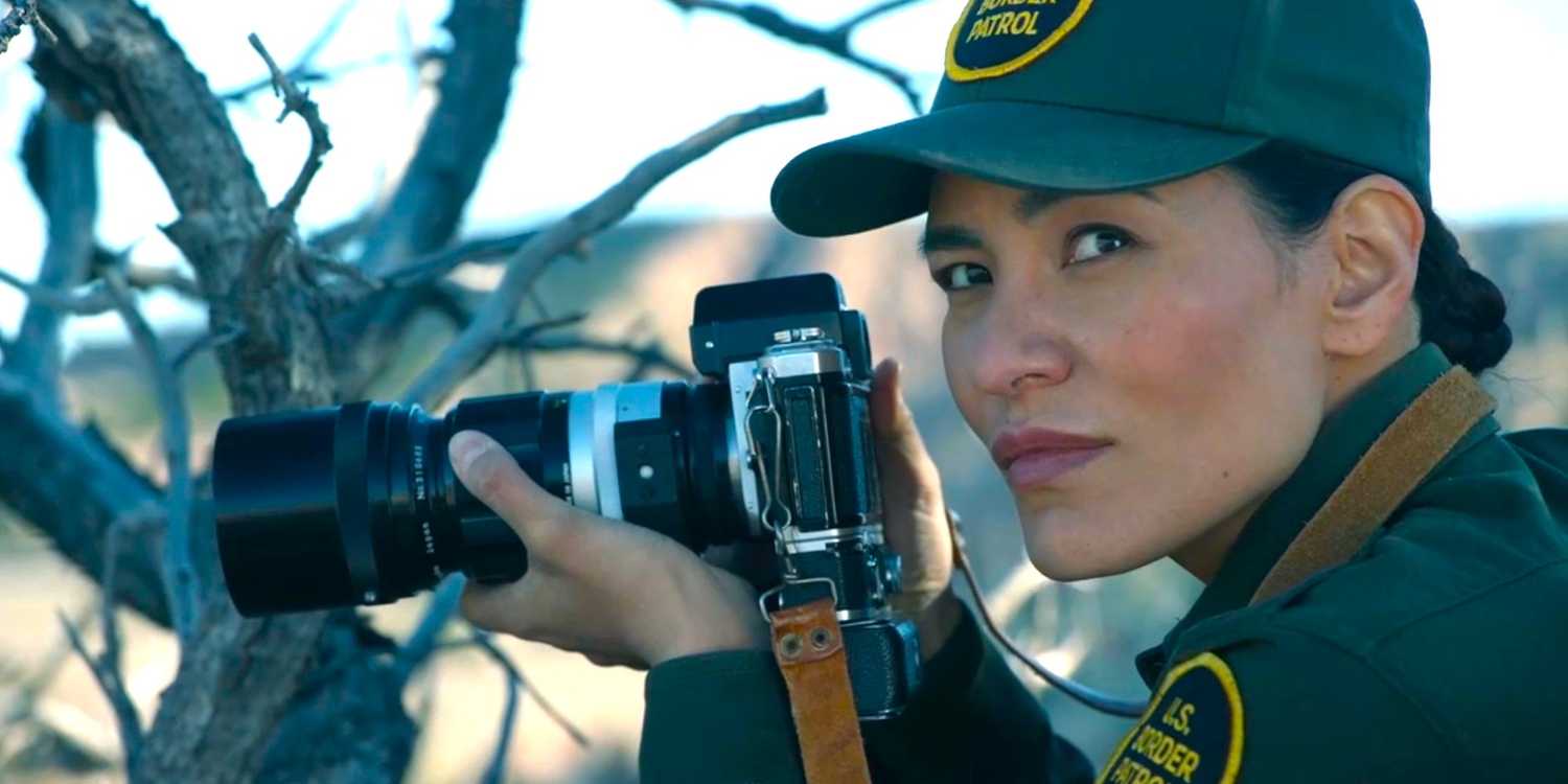 Bernadette Manuelito (Jessica Matten) looking up from her camera in Dark Winds season 3, episode 2