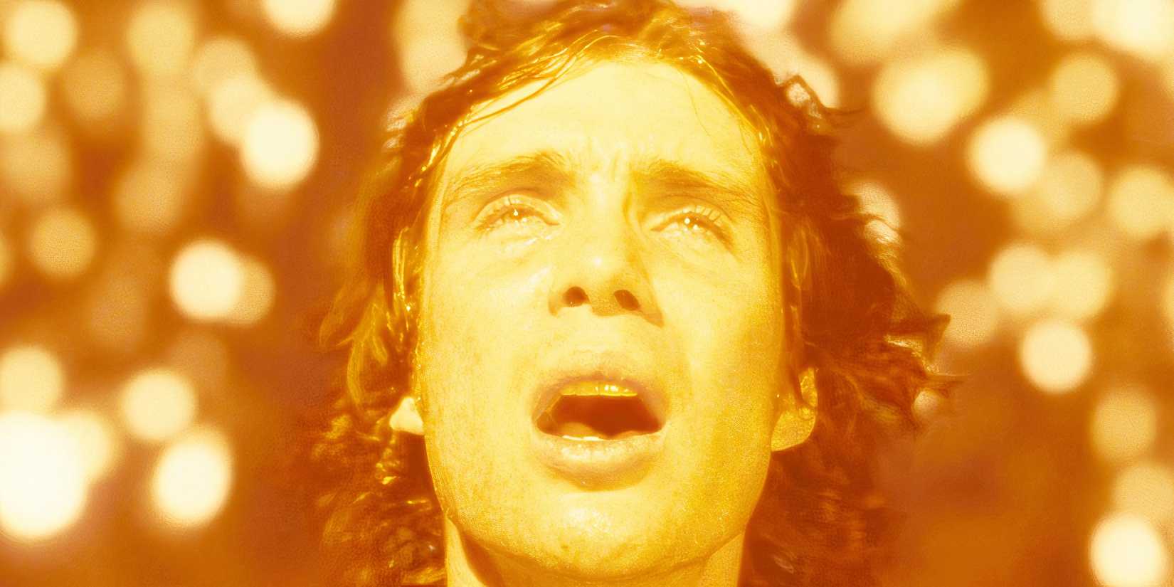 Cillian Murphy with his mouth agape surrounded by sparks in Sunshine