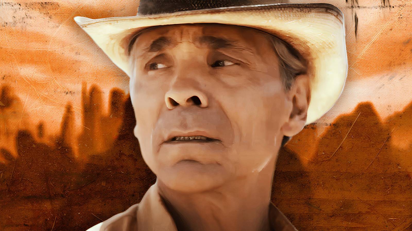 Zahn McClarnon as Joe Leaphorn in Dark Winds season 3 on a background of canyons and arroyos
