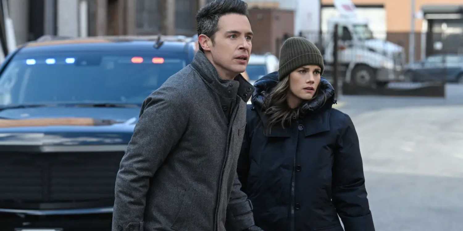 FBI Scola and Maggie in winter clothes walking across a street together