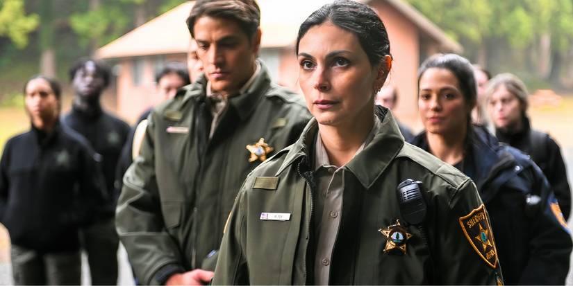 Morena Baccarin as Mickey Fox standing among a group of officers in Fire Country