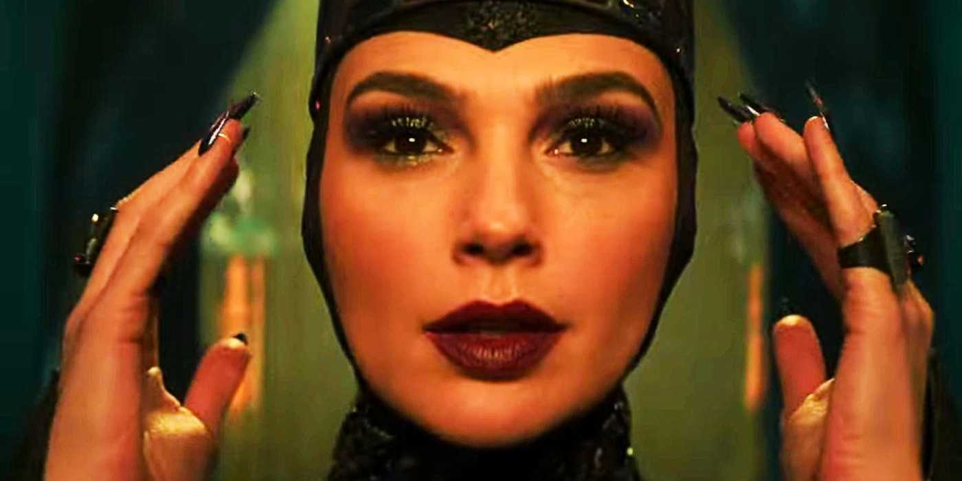 Gal Gadot as the Evil Queen adjusting her crown in Snow White