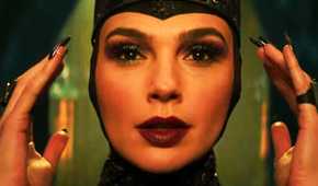 Gal Gadot as the Evil Queen adjusting her crown in Snow White