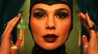 Gal Gadot as the Evil Queen adjusting her crown in Snow White