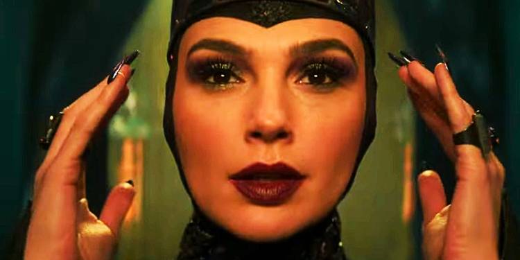 Gal Gadot as the Evil Queen adjusting her crown in Snow White