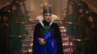 Gal Gadot as the Evil Queen walks down the stairs in Snow White 2025