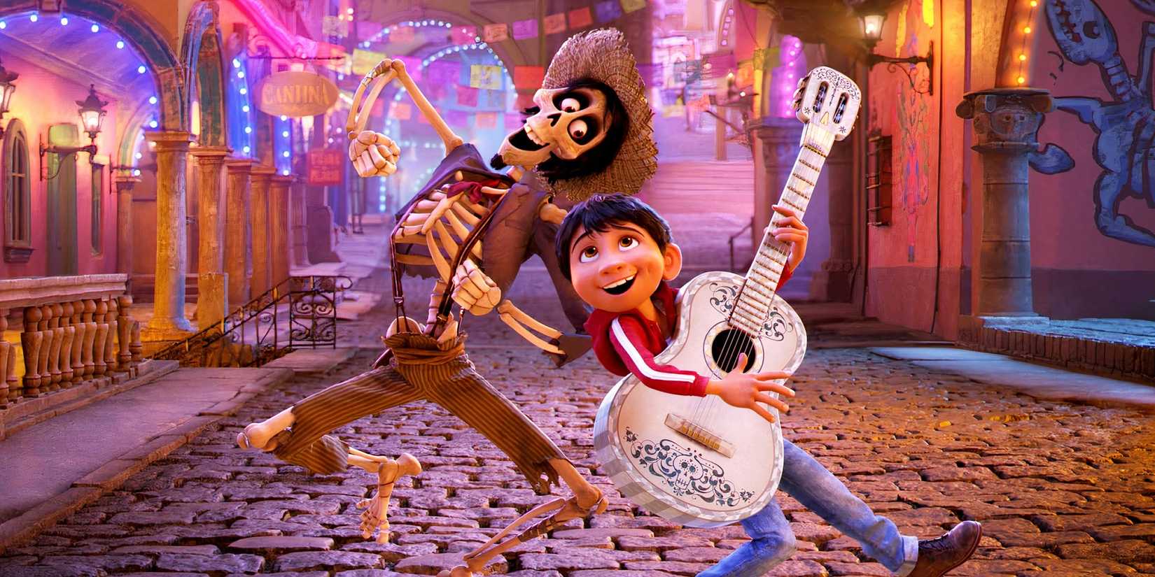 Hector and Miguel sing in the street in Coco