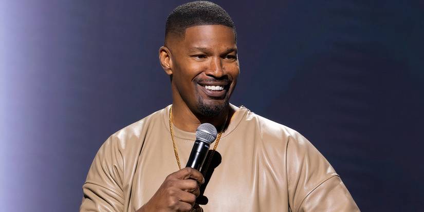 Jamie Foxx smiling on stage doing stand-up in What Had Happened Was