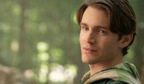 Jonathan leans against a tree in Snow White (2025)