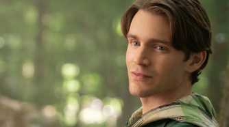 Jonathan leans against a tree in Snow White (2025)