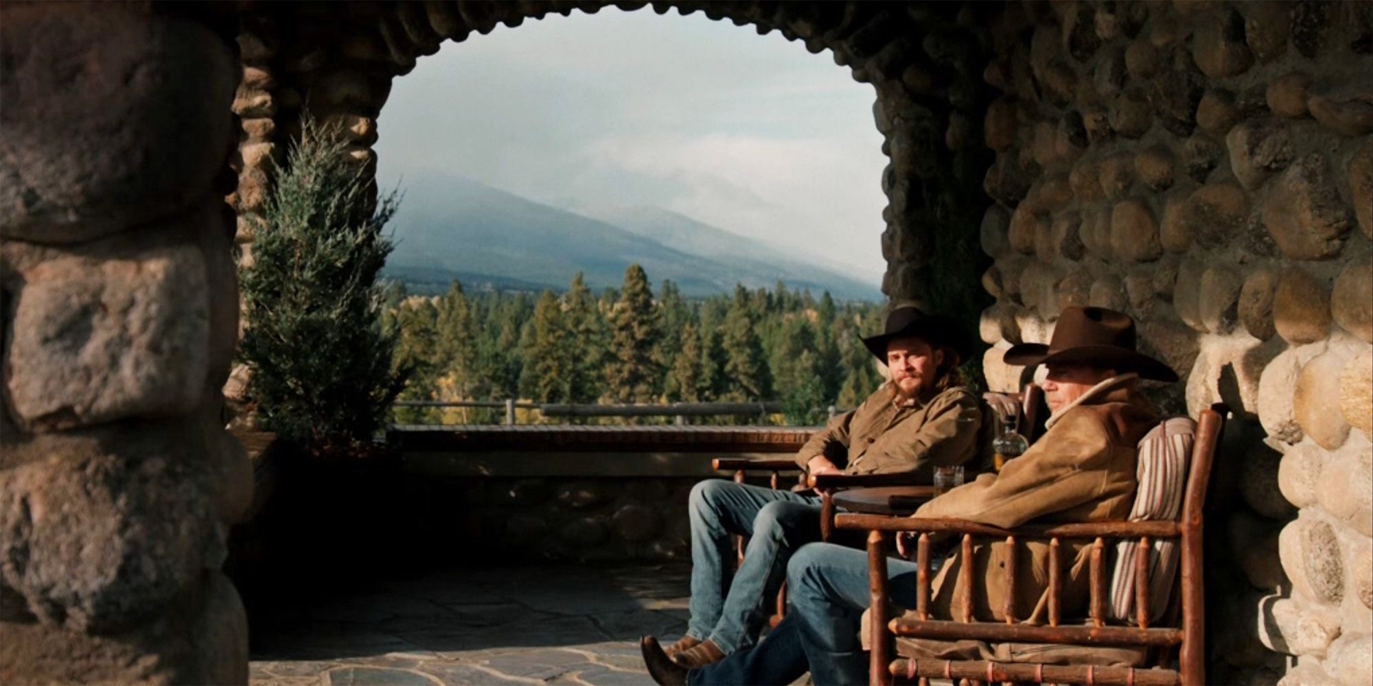 Kayce and John sit on the front porch in Yellowstone