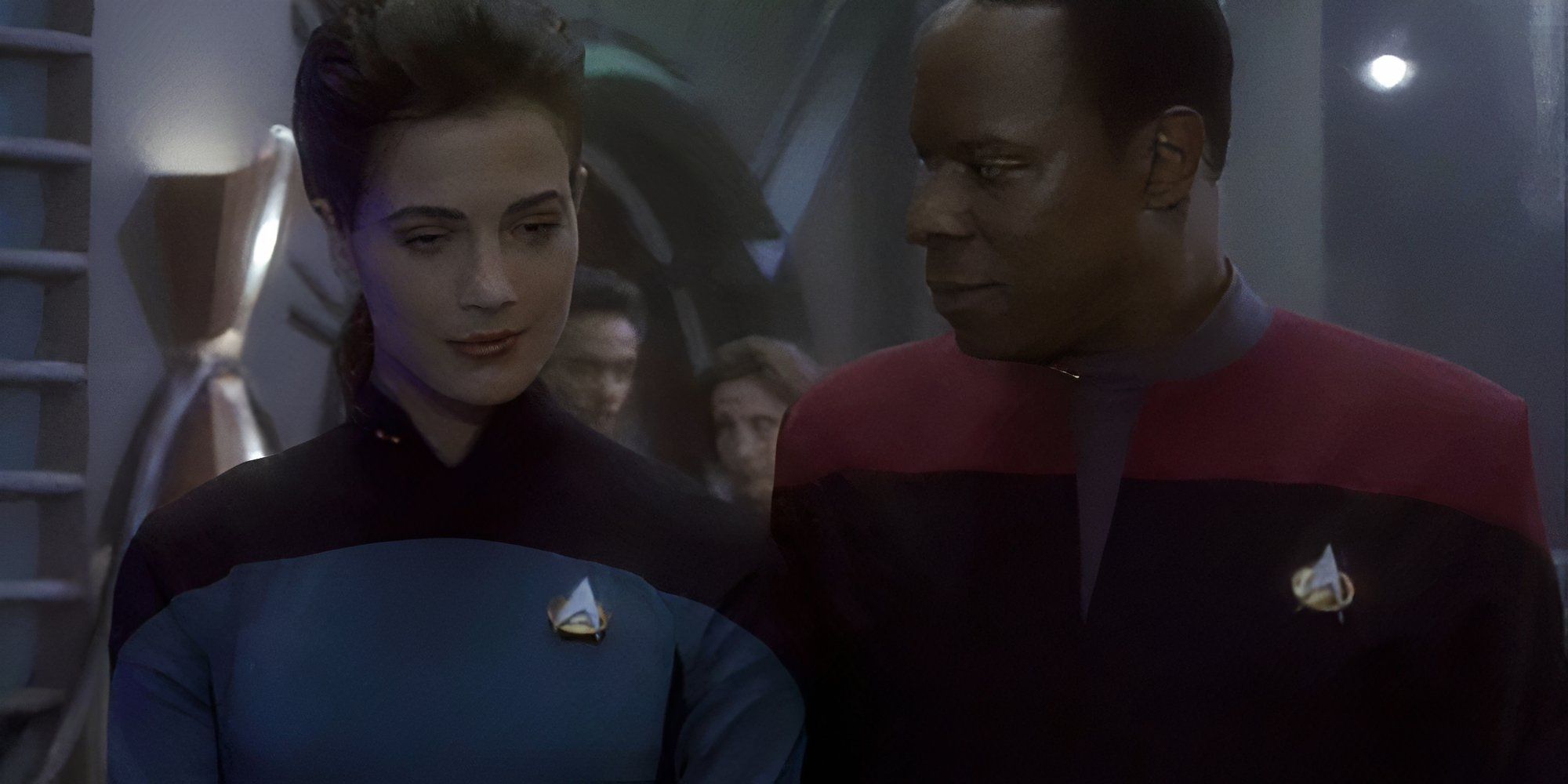 Lt Jadzia Dax (Terry Farrell) in TNG style uniform with Commander Benjamin Sisko (Avery Brooks) in DS9 Emissary