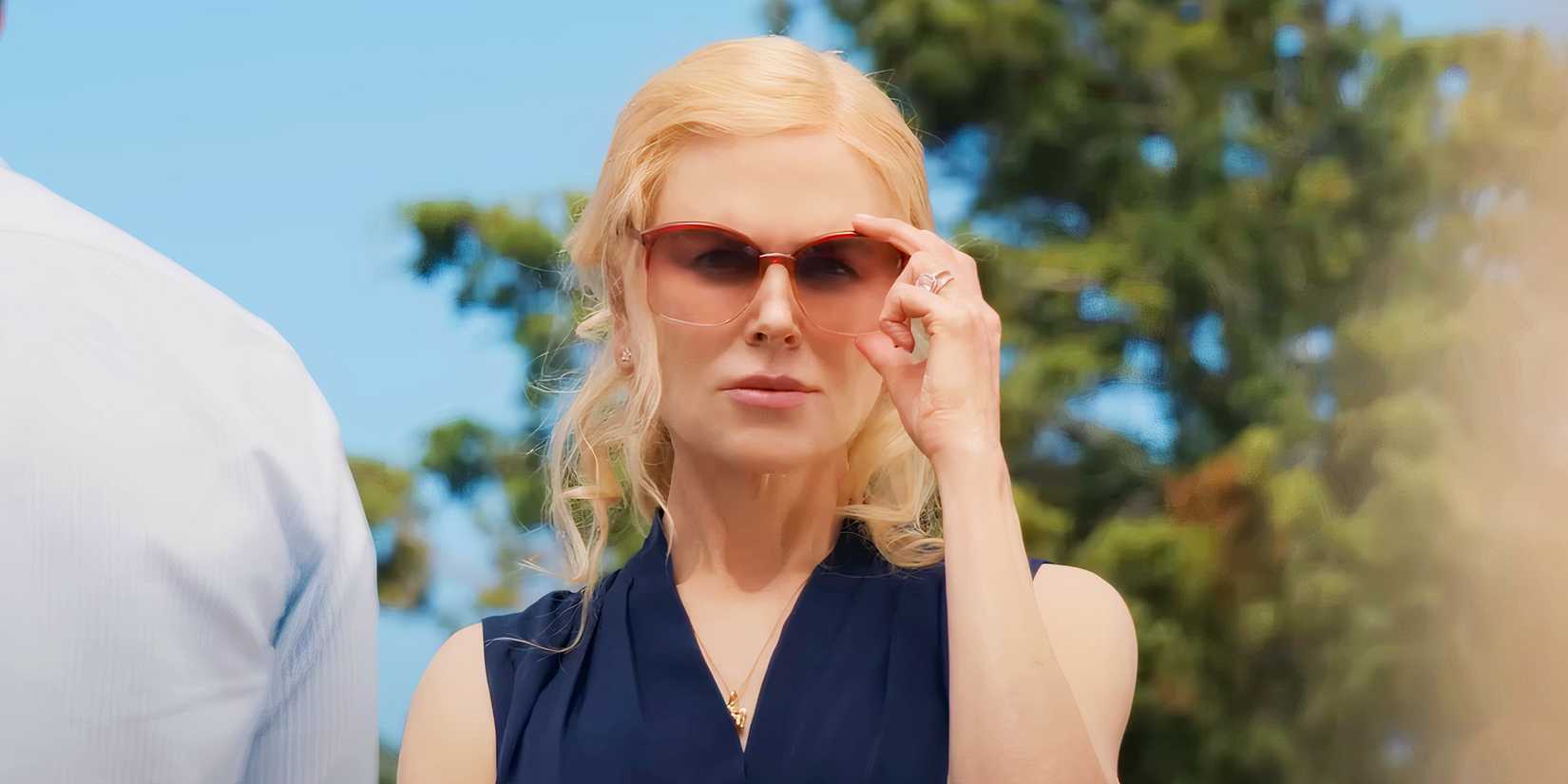 Nicole Kidman adjusting her glasses in The Perfect Couple